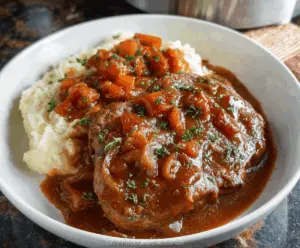 Delicious slow cooker Swiss steak with tender beef and savory sauce served with vegetables.