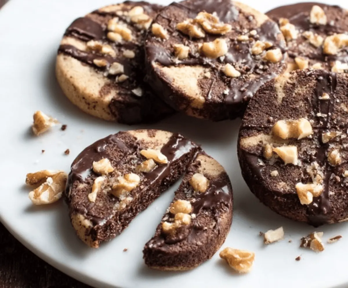Delicious chocolate walnut shortbread cookies on a platter, perfect for dessert or tea time.