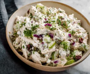 Creamy cottage cheese chicken salad with fresh vegetables and herbs, perfect for a healthy meal.