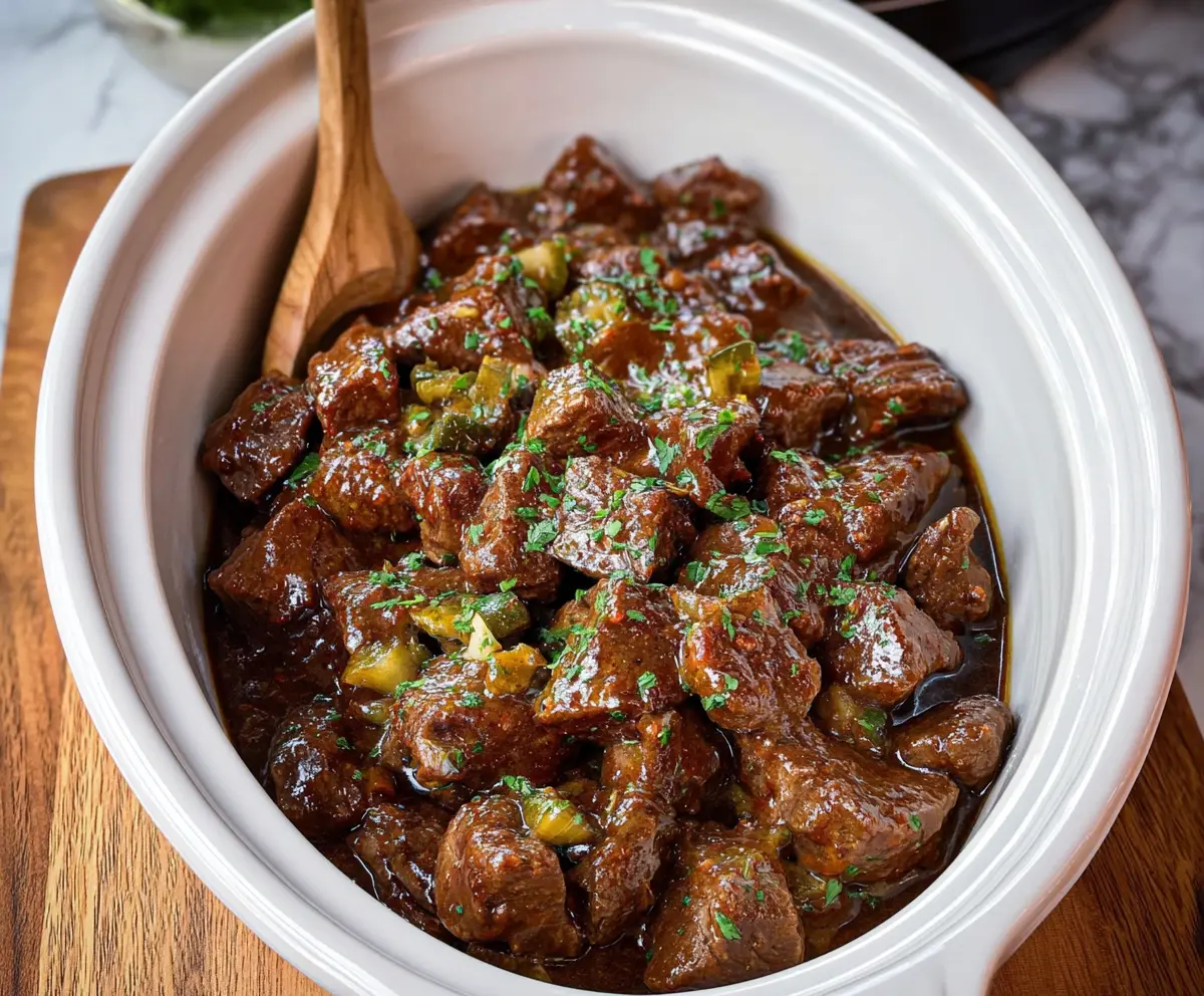 Delicious Crockpot Mississippi Steak Bites served with fresh herbs and side dishes
