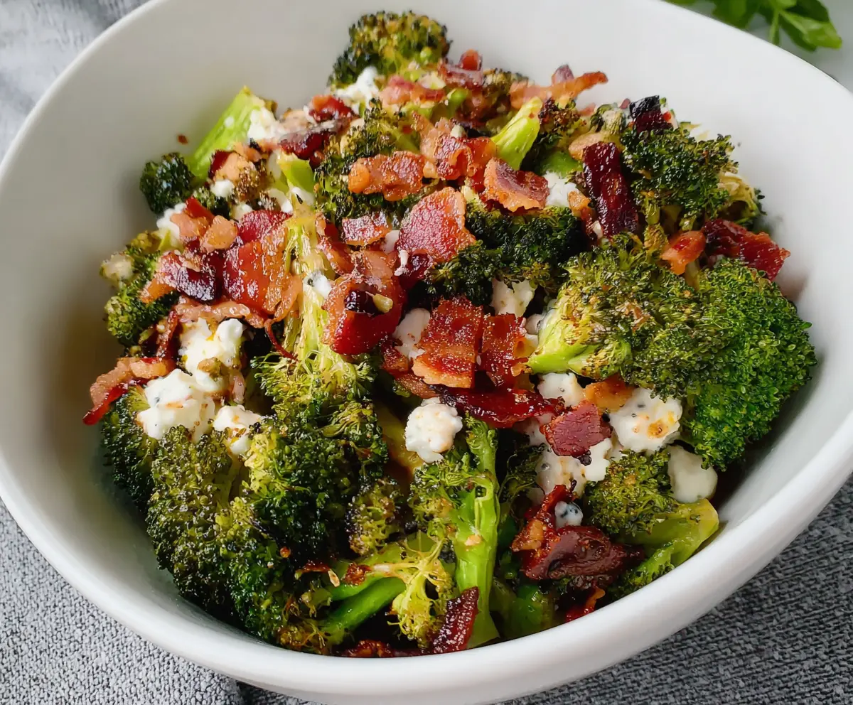 Fresh roasted broccoli and crispy bacon salad with crunch toppings for a healthy and savory meal.